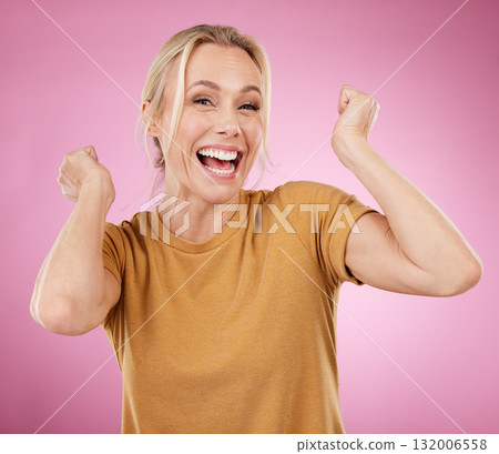 Excited, winner and winning mature woman cheering for a prize isolated against a pink studio background happy and smile. Portrait, celebration and older female celebrate win feeling cheerful Excited, winner and winning mature woman cheering for a prize isolated against a pink studio background happy and smile. Portrait, celebration and older female celebrate win feeling cheerful 132006558