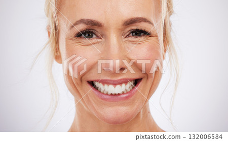 Teeth whitening, portrait and smile of woman in studio, beauty background and fresh mint breath. Happy female model, face and skincare for dental wellness, tooth implant and aesthetic facial salon 132006584