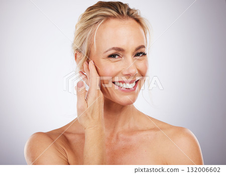 Beauty, hand on face and portrait of woman for skincare, cosmetics and anti aging dermatology. Mature aesthetic model on studio grey background for self love, care and healthy or wellness facial glow 132006602