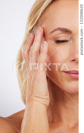Closeup, skincare and woman with cosmetics, dermatology and morning routine against studio background. Zoom mature female and lady with grooming, luxury salon treatment and smooth skin on backdrop Closeup, skincare and woman with cosmetics, dermatology and morning routine against studio background. Zoom mature female and lady with grooming, luxury salon treatment and smooth skin on backdrop 132006620