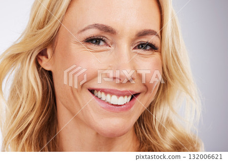 Portrait, skincare and happy with a woman in studio on a gray background for beauty or antiaging treatment. Face, smile and cosmetics with an attractive female in the bathroom for natural skin Portrait, skincare and happy with a woman in studio on a gray background for beauty or antiaging treatment. Face, smile and cosmetics with an attractive female in the bathroom for natural skin 132006621