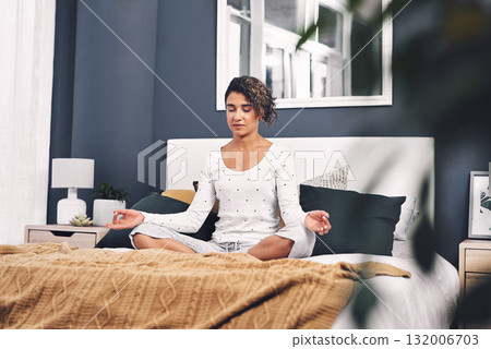 Meditation, lotus and woman exercise in home bedroom for peace, mental health and calm chakra. Female person with hands to meditate for spiritual healing, zen and holistic yoga to relax on bed Meditation, lotus and woman exercise in home bedroom for peace, mental health and calm chakra. Female person with hands to meditate for spiritual healing, zen and holistic yoga to relax on bed 132006703