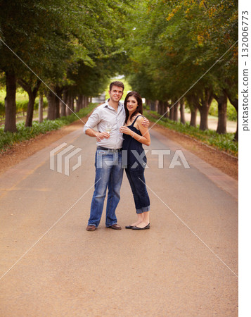 Couple, portrait and wine outdoor at a vineyard for vacation, holiday or travel with love and care. Man and a woman hug on a countryside road with trees, alcohol glass or drinks to celebrate marriage 132006773