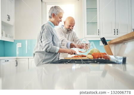 Cooking, nutrition and a senior couple in the kitchen of their home together during retirement for meal preparation. Health, wellness or food with a mature man and woman making supper in their house Cooking, nutrition and a senior couple in the kitchen of their home together during retirement for meal preparation. Health, wellness or food with a mature man and woman making supper in their house 132006778