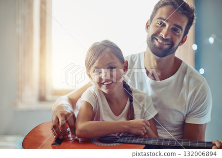 Man, young girl and guitar with teaching and learning at home, bonding with love and creativity in portrait. Family, father and daughter learn to play musical instrument, lesson and music education Man, young girl and guitar with teaching and learning at home, bonding with love and creativity in portrait. Family, father and daughter learn to play musical instrument, lesson and music education 132006894
