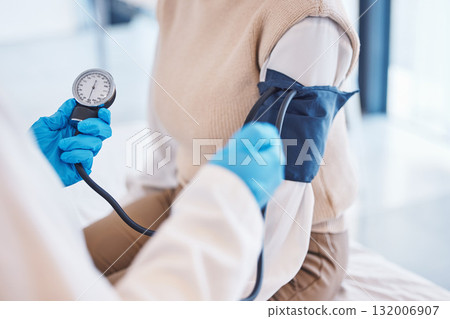 Hands, doctor and patient with blood pressure test and healthcare advice at clinic. Woman consulting medical professional, health care check and insurance, info and help with wellness at hospital. Hands, doctor and patient with blood pressure test and healthcare advice at clinic. Woman consulting medical professional, health care check and insurance, info and help with wellness at hospital. 132006907