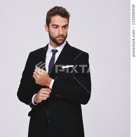 Business, thinking and man with ideas, suit and executive agent isolated against a grey studio background. Male person, thoughtful and entrepreneur with formal wear, trendy clothes and stylish outfit 132006956