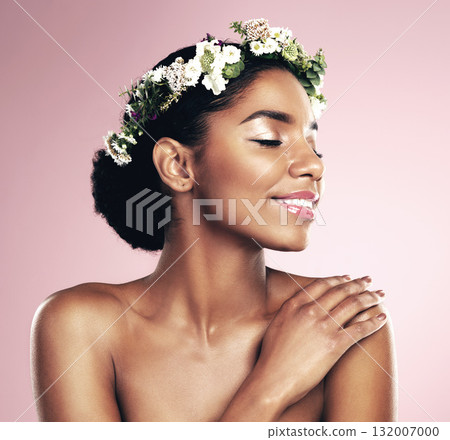 Happy woman, crown of flowers and makeup in studio, pink background and natural skincare aesthetic. African face, female model and floral headband for beauty, sustainable cosmetics and spring fashion 132007000