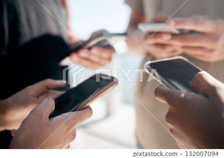 Hands, phone and people networking on social media, mobile app or chatting on mockup screen. Hand of group holding smartphone in circle for online network share, data sync or communication on display 132007094