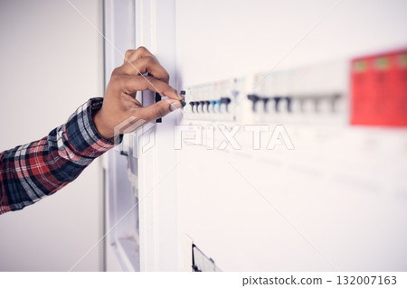 Man, hand and electrician with electricity fuse box, check power supply with maintenance on main circuit breaker switch. Engineer, technician and male worker with handyman and electrical fix Man, hand and electrician with electricity fuse box, check power supply with maintenance on main circuit breaker switch. Engineer, technician and male worker with handyman and electrical fix 132007163
