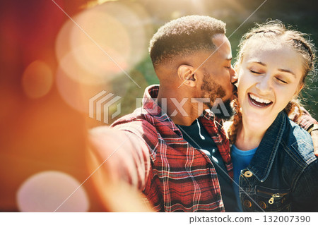 Selfie, kiss and interracial couple on a date in nature for support, love and bonding in Australia. Freedom, trust and black man and woman with kissing affection, quality time and photo for memory 132007390