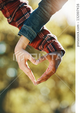Love, care and hands of a couple in a heart for support, diversity and trust in nature. Emoji, marriage and gesture from a man and woman showing emotion, romance and affection on valentines day Love, care and hands of a couple in a heart for support, diversity and trust in nature. Emoji, marriage and gesture from a man and woman showing emotion, romance and affection on valentines day 132007416