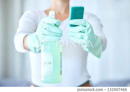 Woman, hands and detergent for housekeeping, cleaning or disinfect with latex gloves in sanitary home. Hand of female cleaner holding sanitizer bottle and sponge for domestic work or clean hygiene 132007466