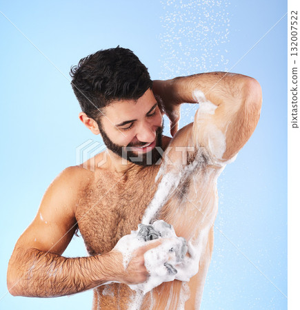 Skincare, man and foam with water, cleaning and showering for wellness and hygiene against blue studio background. Male, gentleman and washing for morning routine, daily and dermatology on backdrop Skincare, man and foam with water, cleaning and showering for wellness and hygiene against blue studio background. Male, gentleman and washing for morning routine, daily and dermatology on backdrop 132007522