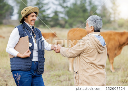 Farm, handshake and collaboration with a woman in agriculture saying thank you to a colleague for sustainability. Agriculture, shaking hands and teamwork with a cattle farmer women in partnership Farm, handshake and collaboration with a woman in agriculture saying thank you to a colleague for sustainability. Agriculture, shaking hands and teamwork with a cattle farmer women in partnership 132007524