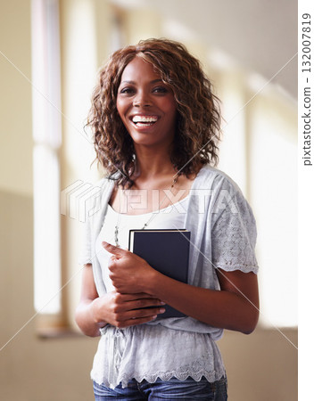 Teacher, portrait and black woman with notebook in school hallway with pride for career or job. Education, book and funny female educator in corridor ready for teaching or working in South Africa. Teacher, portrait and black woman with notebook in school hallway with pride for career or job. Education, book and funny female educator in corridor ready for teaching or working in South Africa. 132007819