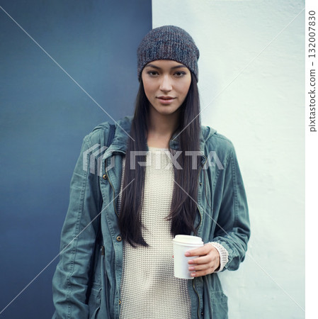 Portrait of a woman with a cup of coffee by a wall with a casual, trendy and stylish outfit. Beautiful, gen z and young female person with takeaway warm beverage and cool fashion or style in the city 132007830
