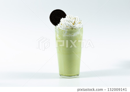 Matcha Frappuccino topped with cookies and whipped cream 132009141