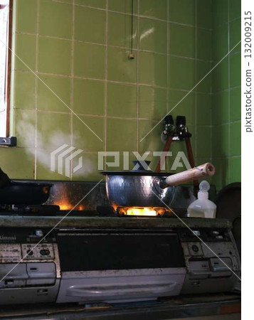 Cooking in the kitchen Cooking in the kitchen 132009215