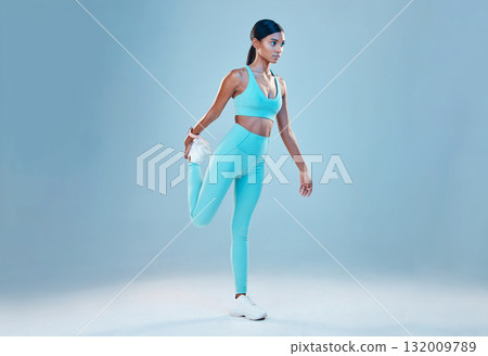 Fitness, stretching legs and mockup with a woman in studio on a gray background for health or sports. Exercise, warm up and space with a female athlete training for a healthy body or lifestyle 132009789