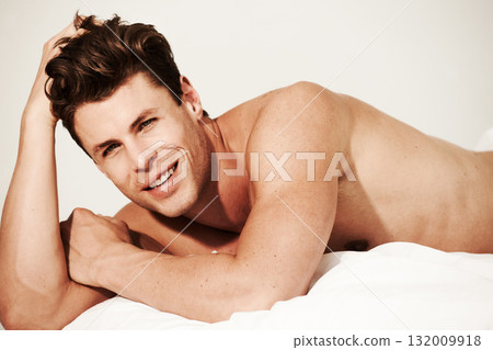 Portrait, sexy and man on a bed, handsome and happiness with health, wellness and comfort. Face, male person or happy guy in a bedroom, natural and body with beauty, hunk and alluring with confidence Portrait, sexy and man on a bed, handsome and happiness with health, wellness and comfort. Face, male person or happy guy in a bedroom, natural and body with beauty, hunk and alluring with confidence 132009918