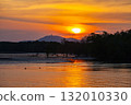 Beautiful golden sun slow down behind the mountain 132010330