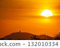 Beautiful golden sun slow down behind the mountain 132010334