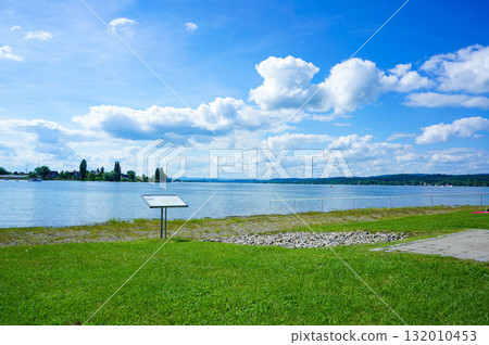 A magnificent view from the lakeside under a beautiful blue sky A magnificent view from the lakeside under a beautiful blue sky 132010453