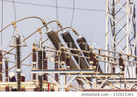 High voltage ceramic insulators on towers in Power Substation. 132011361