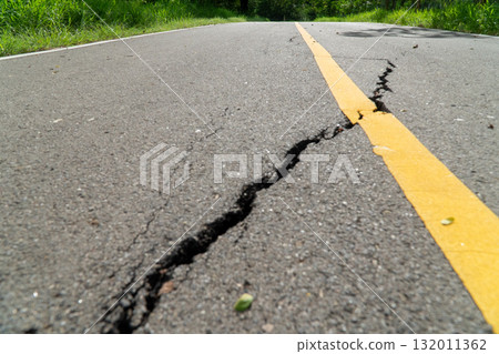Asphalt road damaged by earthquakes in Thailand. 132011362