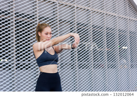Sport woman outdoor workout shows fit people stretch during exercise, demonstrating strong dedication to personal health and active sport lifestyle goals. Sport woman outdoor workout shows fit people stretch during exercise, demonstrating strong dedication to personal health and active sport lifestyle goals. 132012064