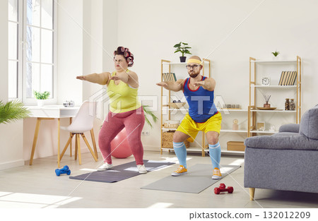 Funny plump woman doing squats with her personal trainer 132012209