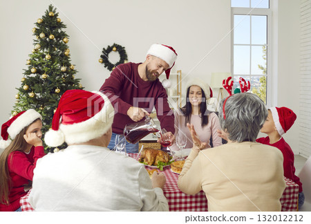 Big family celebrates winter holidays together by gathering for breakfast on Christmas morning. Big family celebrates winter holidays together by gathering for breakfast on Christmas morning. 132012212