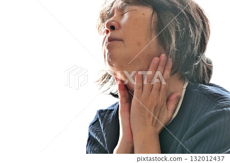 Senior woman concerned about her neck Senior woman concerned about her neck 132012437