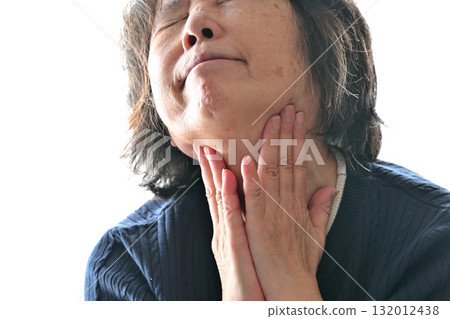 Senior woman concerned about her neck Senior woman concerned about her neck 132012438