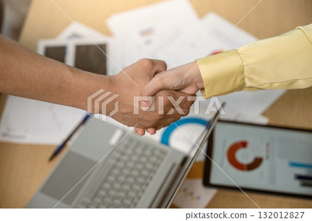 Business handshake. Asian business people making a handshake, close up. Two corporate businesspeople shaking hands during meeting in office, business union company, successful deal, teamwork, partners Business handshake. Asian business people making a handshake, close up. Two corporate businesspeople shaking hands during meeting in office, business union company, successful deal, teamwork, partners 132012827