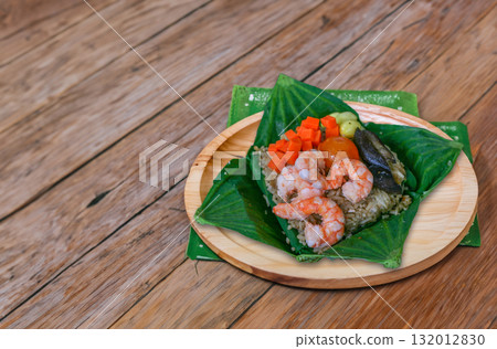 Steamed sticky rice wrapped in lotus leaf Steamed sticky rice wrapped in lotus leaf 132012830