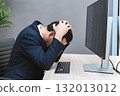 Young Businessman or Programmer looking worried and stressed over working on a computer code at office. 132013012