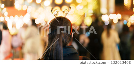 happy tourist woman stands on a German christmas market . Merry Christmas, holiday and happy New Year concept happy tourist woman stands on a German christmas market . Merry Christmas, holiday and happy New Year concept 132013408