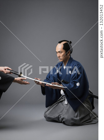 Accepting a family heirloom Japanese sword 132013452