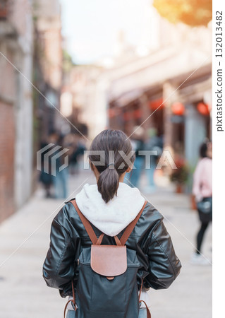 woman traveler visiting in Taiwan, Tourist with backpack sightseeing at Bopiliao Historic Block, landmark and popular attractions in Taipei city. Asia Travel and vacation concept woman traveler visiting in Taiwan, Tourist with backpack sightseeing at Bopiliao Historic Block, landmark and popular attractions in Taipei city. Asia Travel and vacation concept 132013482