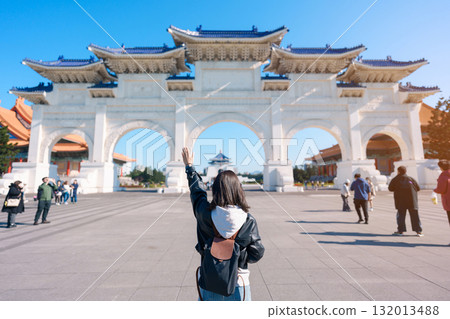 woman traveler visiting in Taiwan, female Tourist sightseeing at National Chiang Kai shek Memorial or Hall Freedom Square, Taipei City. Popular landmark and attractions. Asia Travel concept 132013488