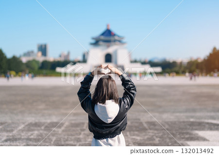 woman traveler visiting in Taiwan, female Tourist sightseeing at National Chiang Kai shek Memorial or Hall Freedom Square, Taipei City. Popular landmark and attractions. Asia Travel concept woman traveler visiting in Taiwan, female Tourist sightseeing at National Chiang Kai shek Memorial or Hall Freedom Square, Taipei City. Popular landmark and attractions. Asia Travel concept 132013492