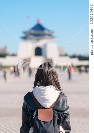 woman traveler visiting in Taiwan, female Tourist sightseeing at National Chiang Kai shek Memorial or Hall Freedom Square, Taipei City. Popular landmark and attractions. Asia Travel concept 132013498