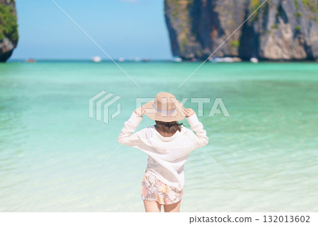 Woman tourist traveling and sightseeing in Krabi, Thailand, happy traveller enjoy at Maya Bay beach on Phi Phi island, Popular paradise island, destination, Southeast Asia Travel, vacation and holiday Woman tourist traveling and sightseeing in Krabi, Thailand, happy traveller enjoy at Maya Bay beach on Phi Phi island, Popular paradise island, destination, Southeast Asia Travel, vacation and holiday 132013602