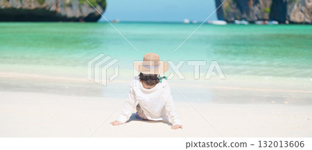 Woman tourist traveling and sightseeing in Krabi, Thailand, happy traveller enjoy at Maya Bay beach on Phi Phi island, Popular paradise island, destination, Southeast Asia Travel, vacation and holiday Woman tourist traveling and sightseeing in Krabi, Thailand, happy traveller enjoy at Maya Bay beach on Phi Phi island, Popular paradise island, destination, Southeast Asia Travel, vacation and holiday 132013606