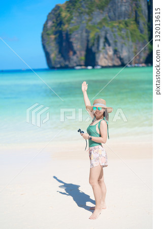 Woman tourist traveling and sightseeing in Krabi, Thailand, happy traveller enjoy at Maya Bay beach on Phi Phi island, Popular paradise island, destination, Southeast Asia Travel, vacation and holiday Woman tourist traveling and sightseeing in Krabi, Thailand, happy traveller enjoy at Maya Bay beach on Phi Phi island, Popular paradise island, destination, Southeast Asia Travel, vacation and holiday 132013615
