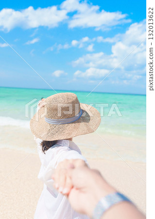 couple tourist relaxing and enjoying on beach, happy traveller looking beautiful sea view on tropical island. Honeymoon, tropical destination, southeast Asia Travel, summer vacation and wanderlust 132013622