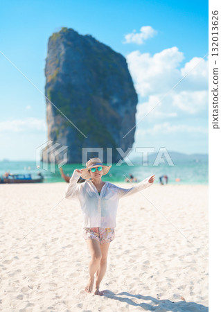 Woman tourist traveling and sightseeing in Krabi, Thailand. happy traveller enjoy on beach at Koh Poda island. summer trip, destination, Southeast Asia Travel, vacation and holiday concept Woman tourist traveling and sightseeing in Krabi, Thailand. happy traveller enjoy on beach at Koh Poda island. summer trip, destination, Southeast Asia Travel, vacation and holiday concept 132013626