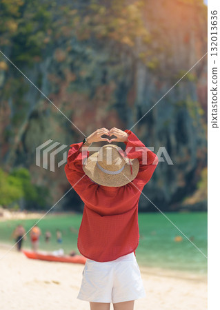 Woman tourist travel and sightseeing in Krabi, Thailand. happy traveller enjoy on beach at Phra nang Cave Beach near Railay Beach. summer trip, destination, Southeast Asia Travel and vacation concept Woman tourist travel and sightseeing in Krabi, Thailand. happy traveller enjoy on beach at Phra nang Cave Beach near Railay Beach. summer trip, destination, Southeast Asia Travel and vacation concept 132013636
